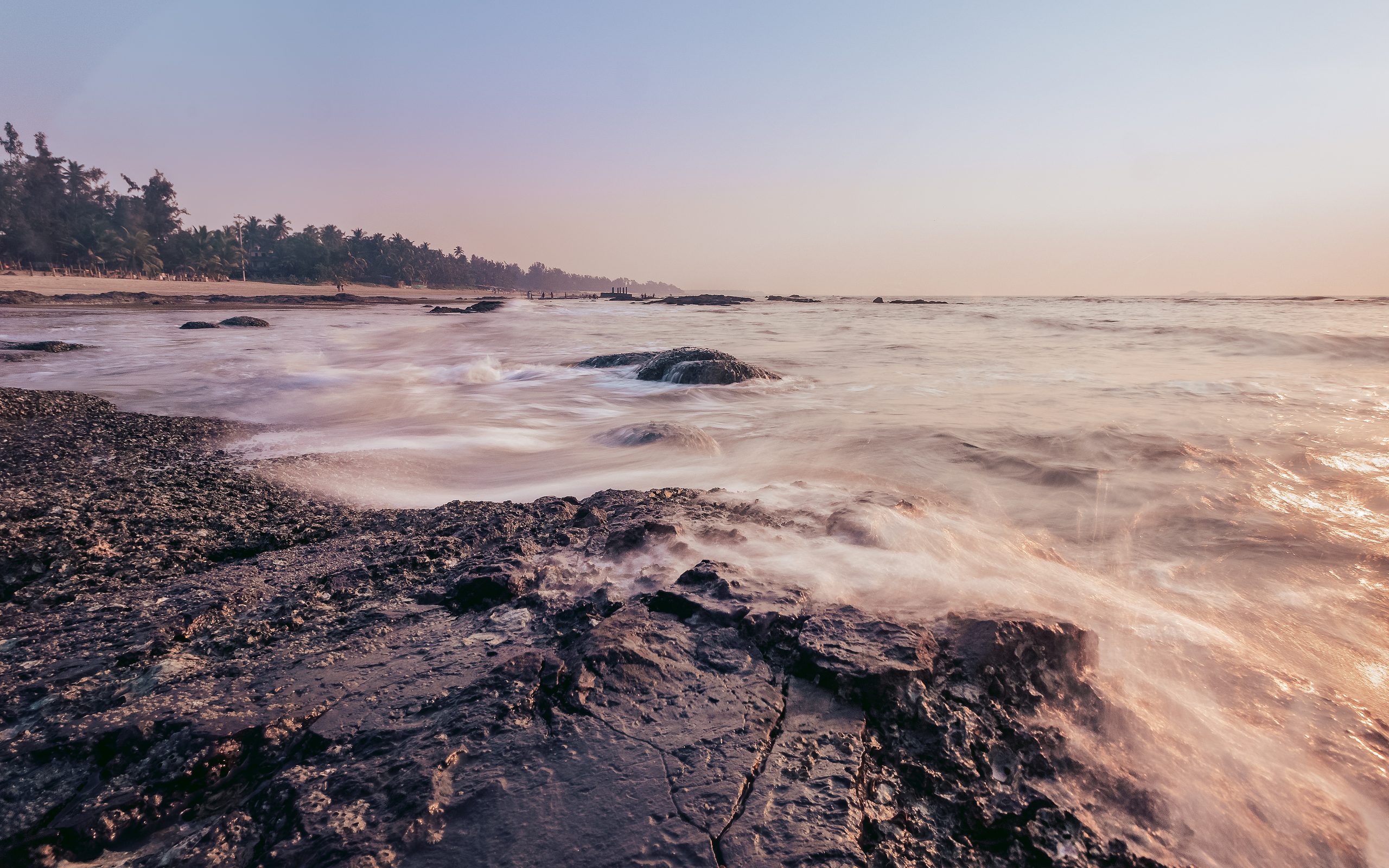 Long exposure of a rocky shore at dawn